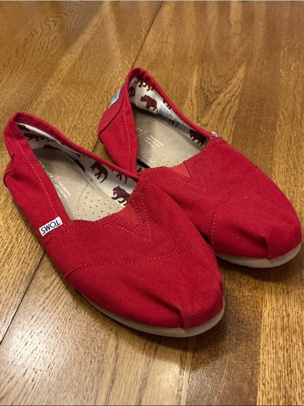 Woman’s Toms Alpargata red classic slip on shoe. Size 9.5. Canvas. Barely worn!